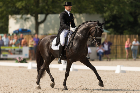Hoofddorp, The Netherlands - August, 2014 - Edward Gal with his horse Glockのeditorial素材