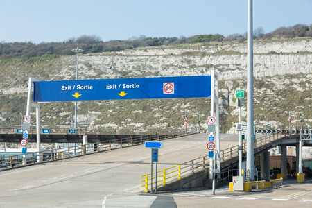 Dover, England - April 7, 2015 - Road signs at Dover port indicating the exit and speedlimitPhoto taken on April 07, 2015のeditorial素材