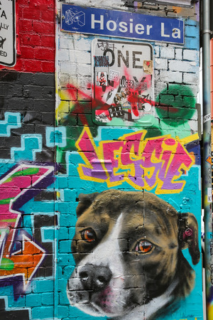 MELBOURNE, AUSTRALIA - October 31, 2016: Colorful graffiti artwork in Hosier Lane with road name street signのeditorial素材