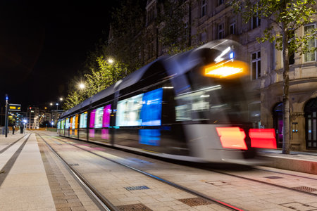 Blurred public transport tram in Luxembourg city coming from the central train station (Gare Centrale)の写真素材