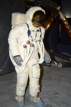 A  space man on the moon with lander behind