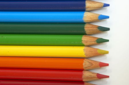 Coloured pencil crayons isolated on a white background