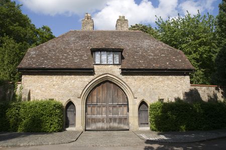 A medieval gate house with a n arched wooden doorの写真素材