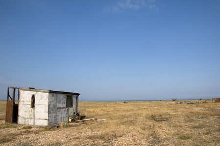 An abandoned beach hut on the beach at Dungenessの写真素材