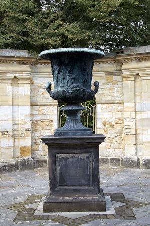 A stone urn in a wall gardenの写真素材