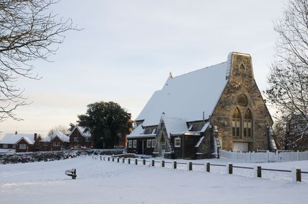 A church covered in snow in a rural settingの写真素材