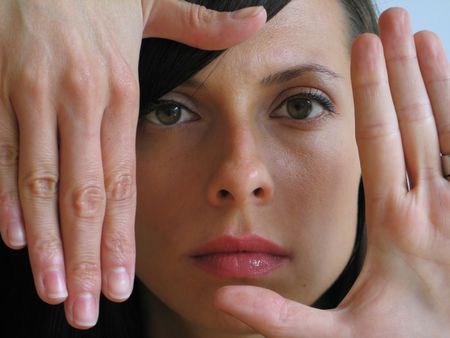 girl portrait with hands around her face
