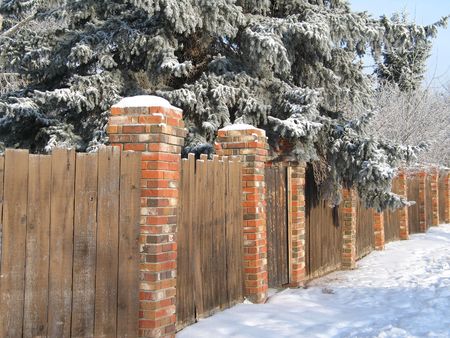 wooden fence with snowの写真素材