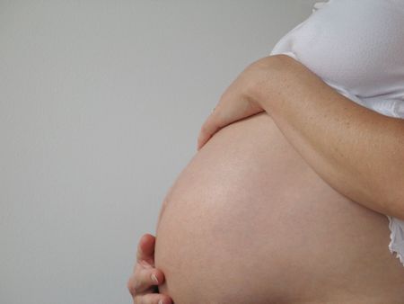 belly of a pregnant young woman