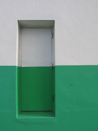 door on a white and green buildingの写真素材