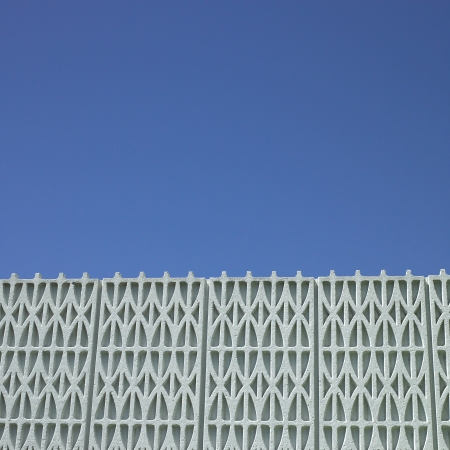 Textured building and blue skyの写真素材