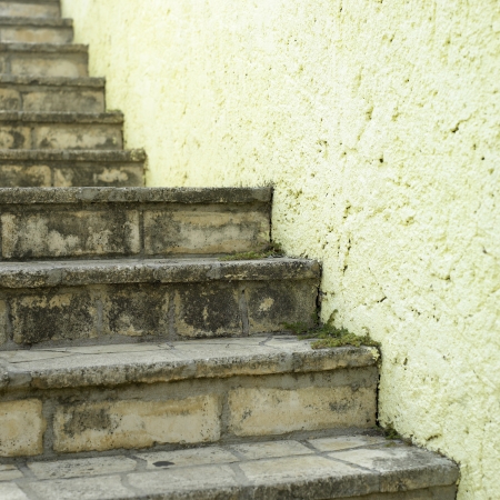 stone steps and yellow wallの写真素材