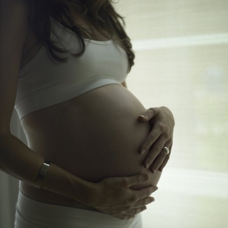 Silhouette of a young pregnant womanの写真素材