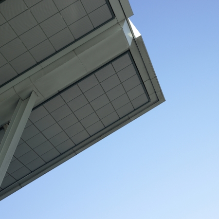 Modern architectural building awning against blue sky