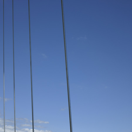 Metal cables against the lue sky