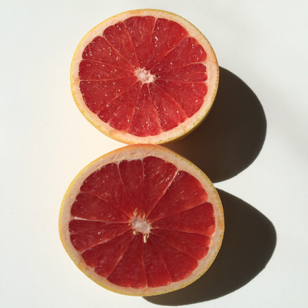 Pink grapefruit cut in halfの写真素材