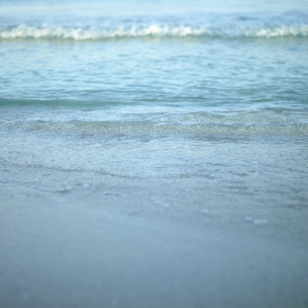 Closeup of a turquoise tropical waveの写真素材