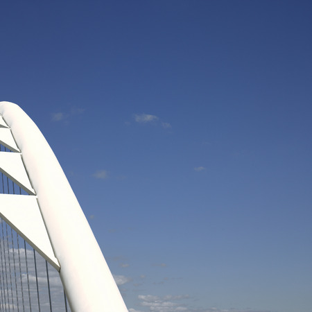 White steel curved modern bridge
