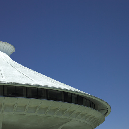 White cement building top and clear blue skyの写真素材