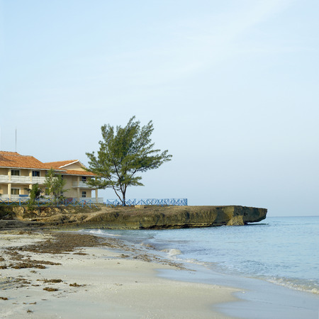 Rocky cliffs and beach of the ocean shore of a seaside resortの写真素材
