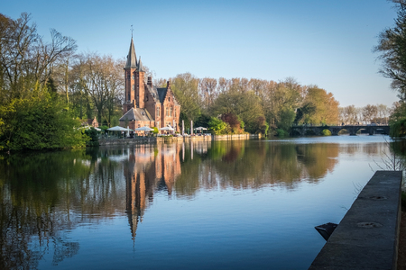 Minnewater Castle and lake panorama in Bruges, Belgiumのeditorial素材