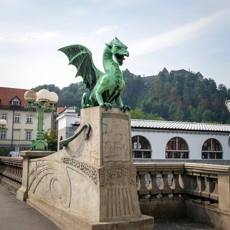 Dragon statue on the Dragon Bridge in Ljubljana, Sloveniaの写真素材