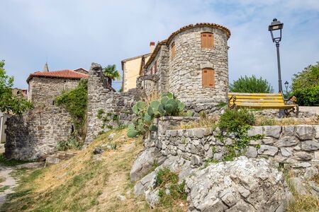 Defensive city walls and houses in famous smallest town in the world - Hum, Croatiaの写真素材