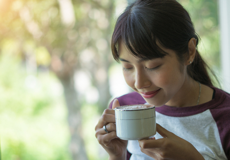 woman in a cafe drinking coffeeの写真素材