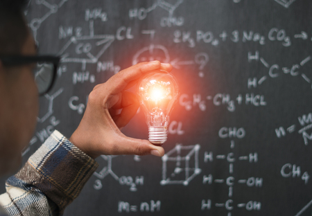 Young businessman with light bulb in idea conceptの写真素材