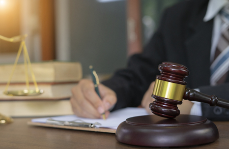 Professional female lawyers working at the law firms. Judge gavel with scales of justice. Legal law, lawyer, advice and justice concept.の写真素材
