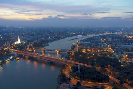 Landscaped areas Buddha Yodfa Bridge is a bridge of communication between the capital of Thonburi in Bangkok at twilight, dramatic sky.の写真素材
