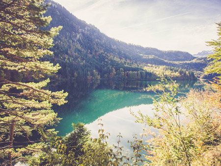 Bavaria, German - October 18, 2013: Beautiful Alpsee and Alps near Hohenschwangau, Germanyのeditorial素材