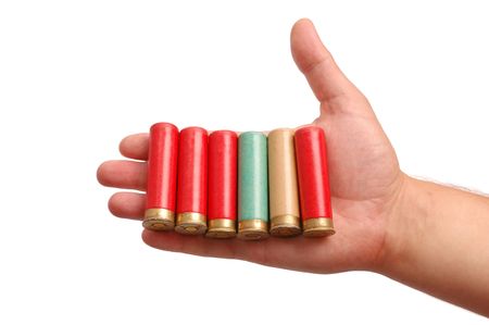 Man's hand with the hunting cartridges on a palm isolated on white