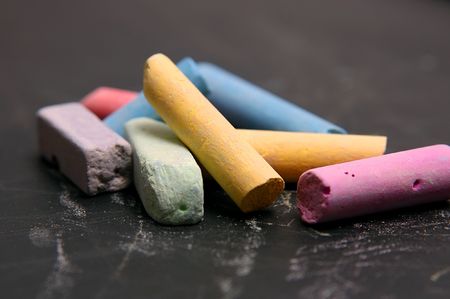 Colour school chalk on a black boardの写真素材