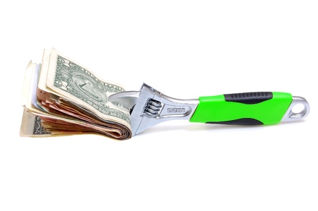 Wrench with money on a white backgroundの写真素材