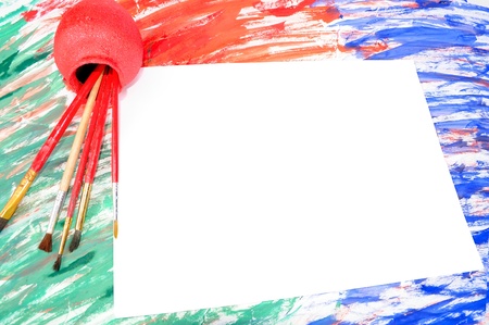 Paper and brushes on an abstract backgroundの写真素材