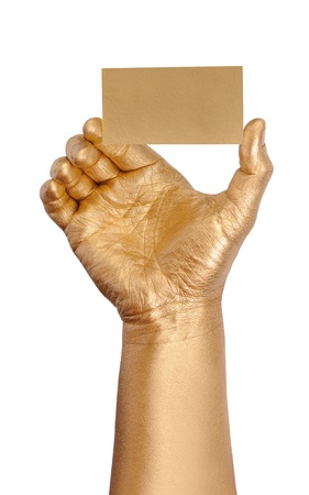 Man's golden hand holding an empty business card over white background の写真素材
