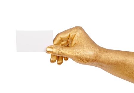 Man s golden hand holding an empty business cardの写真素材