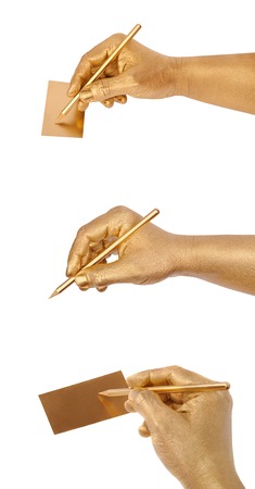 Man's golden hand writes on golden card by a pencil. Isolated on the white. Set from three images for your business presentation, invitation card and other projectsの写真素材