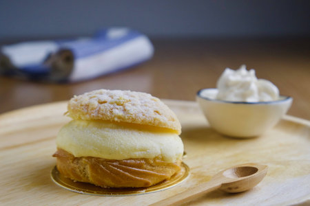 Cream puff topped with sugar powderの写真素材
