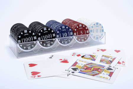 Gambling Chips in Stand with different values and colors and play cards