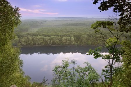 View from steep bank on the forest on the background