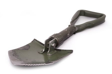 Tri-fold army shovel and pick, field green with some rust, scratches, paint peeling, isolated on white, path. East Europe.                  の写真素材