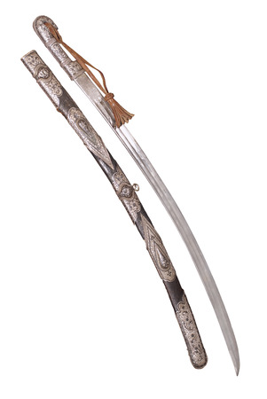 Sabre cavalry sword of Asian type with silver decoration cover and sword-knot. Scabbard also decorated with sliver and engraving. Russia. The beginning of 20 centuryの写真素材