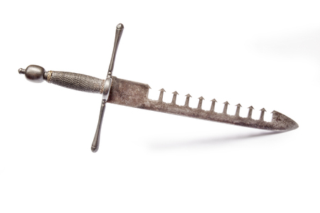 Left hand dagger (so-called swordbreacker). France the end of the XVI century. It has a very sturdy blade with slots on one side, much like the teeth of a comb. The teeth can catch the blade of the opponent's swordの写真素材