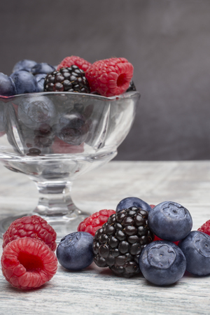 Berries on the mixed background. Blackberry, blueberry and raspberry.の写真素材