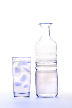 Water bottle and glass with iceの写真素材