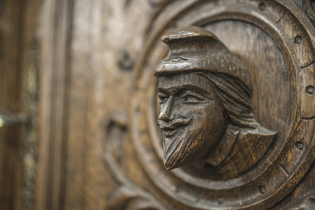 Carved figures on wood, element of decor.の写真素材