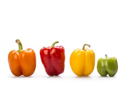 Yellow, red, orange and green paprika isolated on withe  background.の写真素材