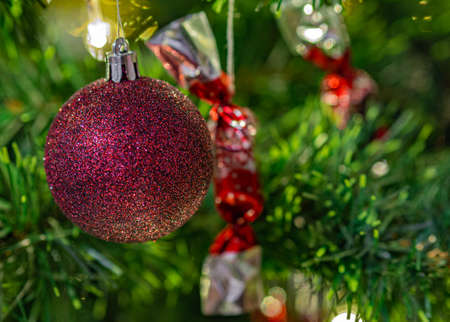 Detail of ornaments on a Christmas tree with sweet confectionery called "szaloncukor".の写真素材